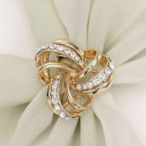 In original package. Gold Three Ring Scarf Buckle.